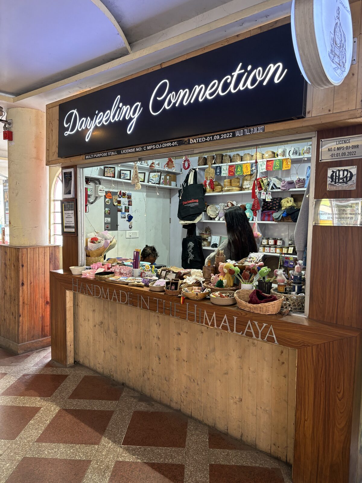 Darjeeling Connection storefront with handcrafted Himalayan souvenirs displayed inside.